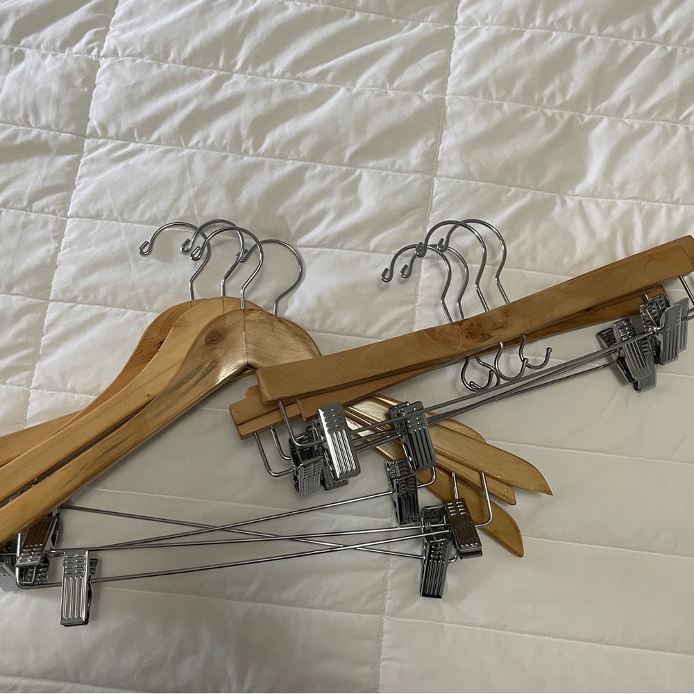 Eight wooden suit/pants/skirt clip hangers
